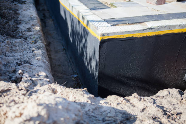 Professional Waterproofing technician working in Woodstock, IL